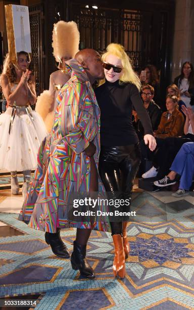 Walks the runway with designer Pam Hogg at the Pam Hogg show during London Fashion Week September 2018 at The Freemason's Hall on September 14, 2018...