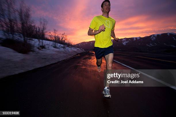 a man runs near salt lake city, utah. - läufer dramatisch stock-fotos und bilder