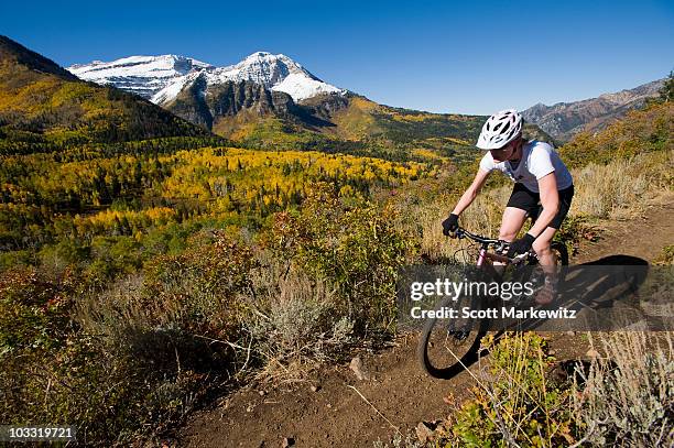 female mountain biker riding in the mountains, provo, utah. - mt timpanogos stock pictures, royalty-free photos & images