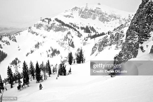 a man skis in wyoming. - jackson hole mountain resort stock pictures, royalty-free photos & images