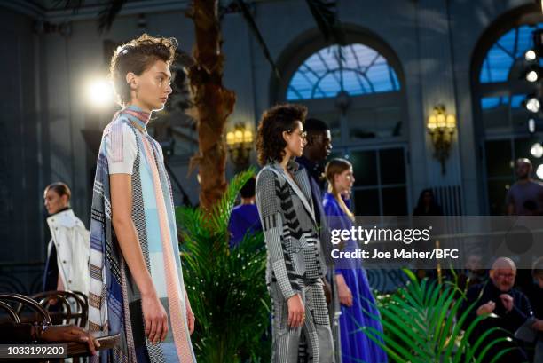 Models pose at the Johnstons of Elgin presentation during London Fashion Week September 2018 at Waldorf Hotel, on September 14, 2018 in London,...