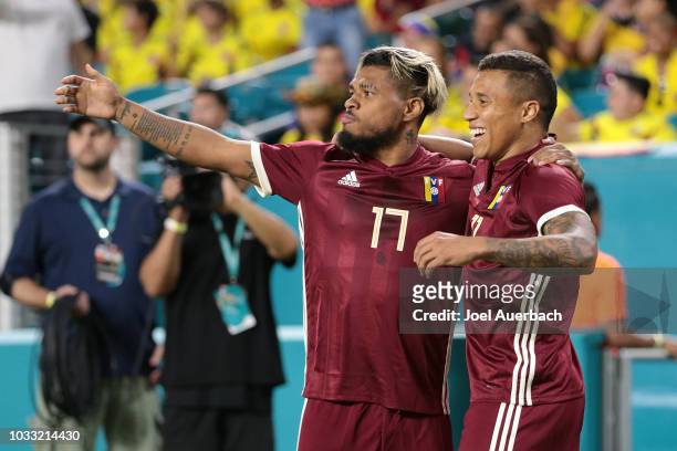 Darwin Machis celebrates his first half goal with Josef Martinez of Venezuela against Colombia during an International friendly match on September 7,...