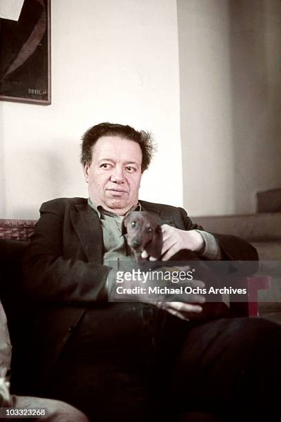 Artist Diego Rivera poses for a portrait at the home and studio she shares with his wife Frida Kahlo, designed by architect Juan O'Gorman circa 1940...