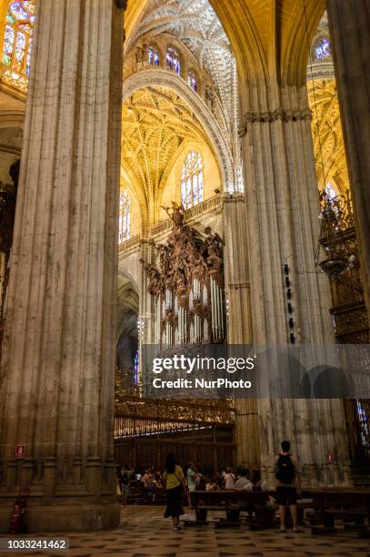 People walk inside the Catedral de Sevilla in Sevilla, Spain, on September 14, 2018.