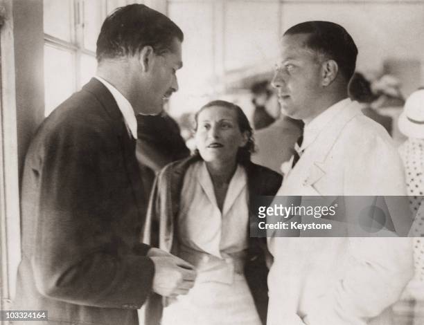 Sir Anthony Eden talks to Count Galeazzo Ciano and Countess Edda Ciano during a luncheon party in Eden's honour in Rome, 27th June 1935. The party is...