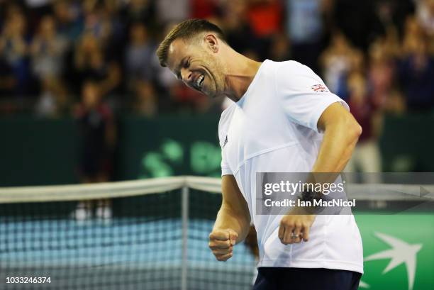 Great Britain captain Leon Smith celebrates as Dan Evans clinches victory over Dennis Istomin during Day One of The Davis Cup match between Great...