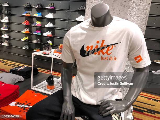 Nike shirt is displayed at a Nike store on September 14, 2018 in San Francisco, California. A week after Nike released a "Just Do It" ad campaign...
