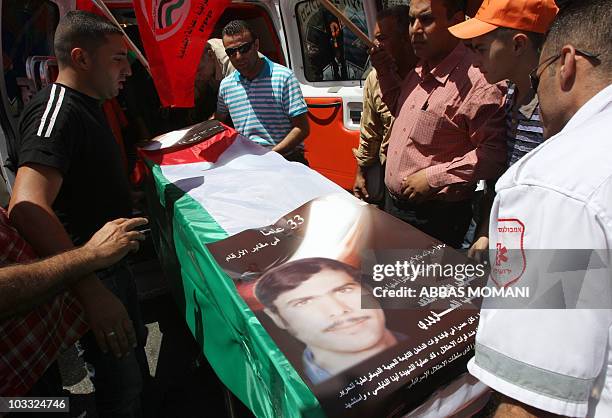 Palestinian supporters of the Democratic Front for the Liberation of Palestine carry the coffin of Mashhur Arouri, a party leader who was killed by...