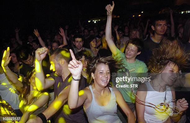 By ALEKSANDRA NIKSIC-- This undated photo shows party goers dancing during an open air concert in Belgrade. Serbia's once-isolated capital Belgrade...