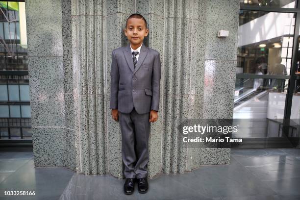 New U.S. Citizen Joaquin Martinez originally from Mexico, poses following a naturalization ceremony conducted by U.S. Citizenship and Immigration...