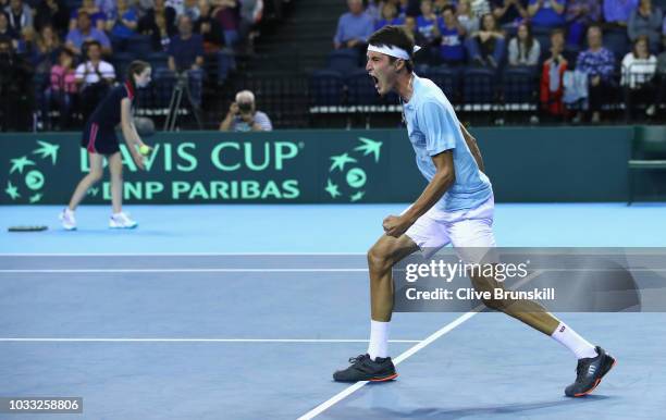 Jurabek Karimov of Uzbekistan celebrates match point against Cameron Norrie of Great Britain during day one of the Davis Cup match between Great...