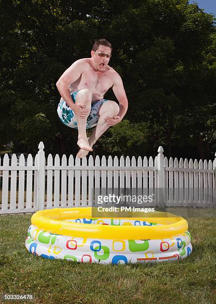 canon ball into kiddie pool - careless ストックフォトと画像