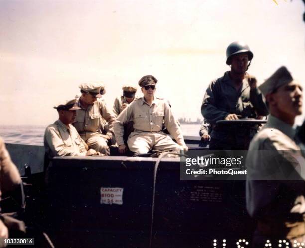 American military commander General Douglas MacArthur inspects the beachhead on Leyte Island, accompanied by Lieutenant General George C. Kenney ,...