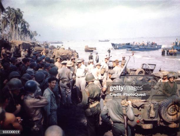 American military commander General Douglas MacArthur , accompanied by Lieutenant General George C. Kenney , Lieutenant General Richard K. Sutherland...