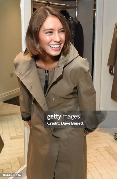 Iris Law attends the launch of the Nick Knight x Alyx Mackintosh limited edition coat during London Fashion Week September 2018 at the Mackintosh...