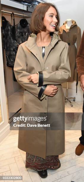 Iris Law attends the launch of the Nick Knight x Alyx Mackintosh limited edition coat during London Fashion Week September 2018 at the Mackintosh...