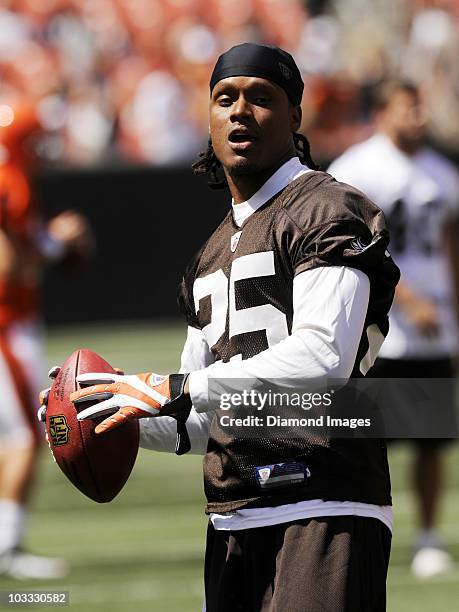 Defensive back Coye Francies of the Cleveland Browns throws a pass prior to the team's family day Brown versus White scrimmage on August 7, 2010 at...