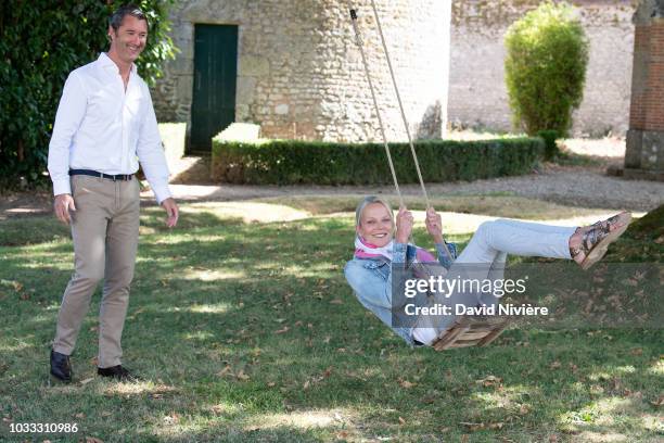 Princess Helene Of Yugoslavia and Stanislas Fougeron pose together in the family castle of Villeprevost On September 7, 2018 in Tillay-le-Peneux,...