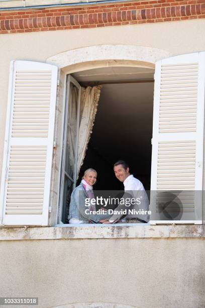 Princess Helene Of Yugoslavia and Stanislas Fougeron pose together in the family castle of Villeprevost On September 7, 2018 in Tillay-le-Peneux,...