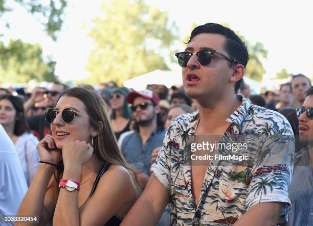 Festivalgoers attend the Tennis performance on the Paper Stage during day 1 of Grandoozy on September 14, 2018 in Denver, Colorado.