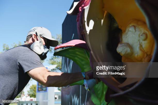 An artist paints during day 1 of Grandoozy on September 14, 2018 in Denver, Colorado.