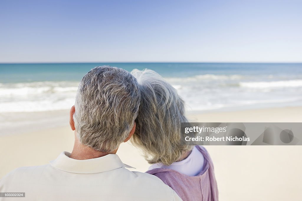 Senior couple hugging on beach