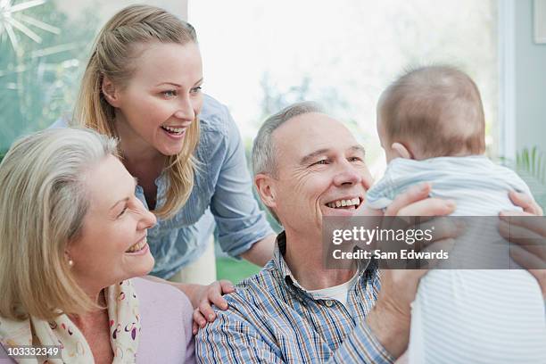 grandparents and mother with baby boy - sam day stockfoto's en -beelden