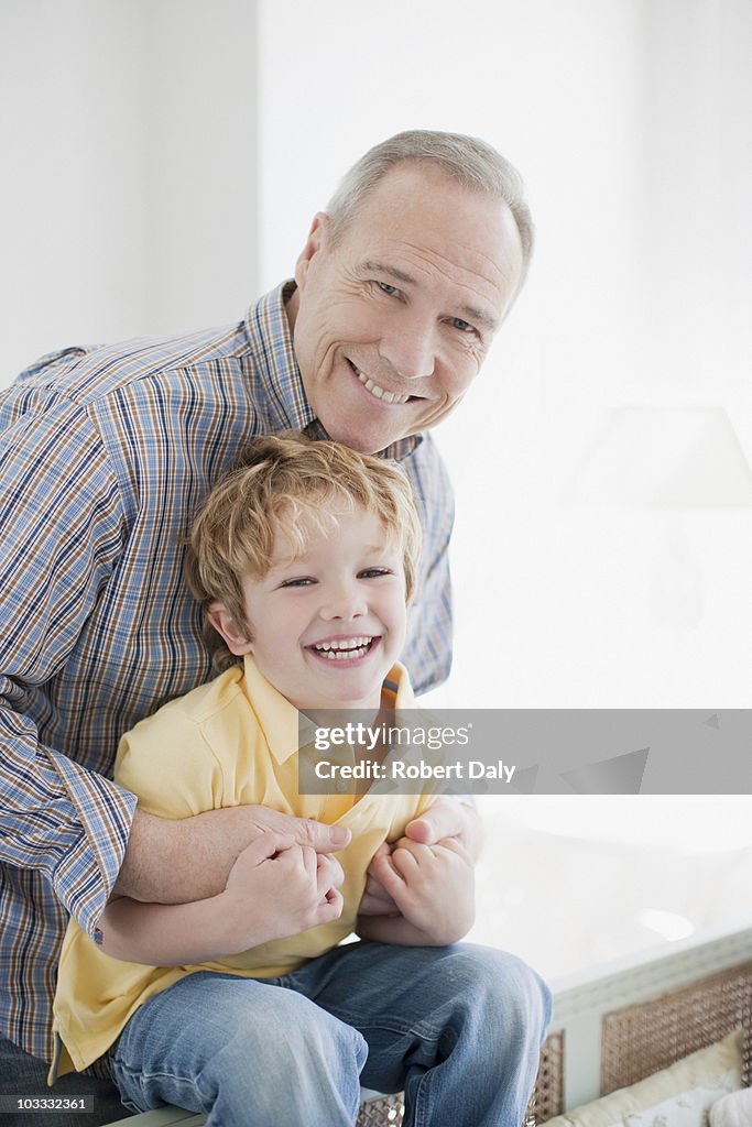 Smiling grandfather and grandson