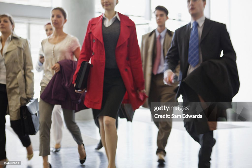 Business people walking in lobby