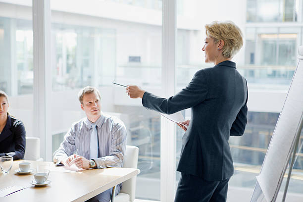 Businesswoman leading discussion in meeting
