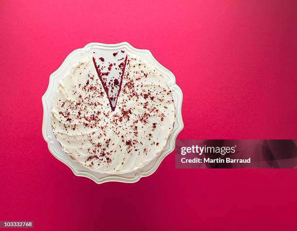 slice missing from chocolate cake on cakestand - cakestand stock pictures, royalty-free photos & images