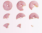 Sequence of bites taken from pink donut
