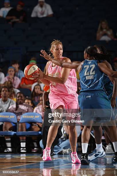 Christi Thomas of the Chicago Sky tries to trick the defense during the WNBA game against the Minnesota Lynx on August 7, 2010 at the All-State Arena...