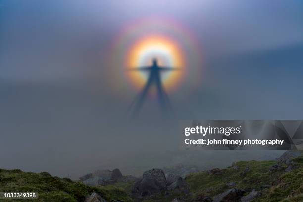 natural phenomena, brocken spectre on helm crag. lake district national park. uk. - north slope alaska stock-fotos und bilder