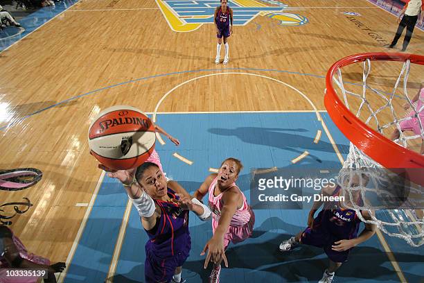 Candice Dupree of the Phoenix Mercury goes to the basket past Christi Thomas of the Chicago Sky during the WNBA game on August 10, 2010 at the...