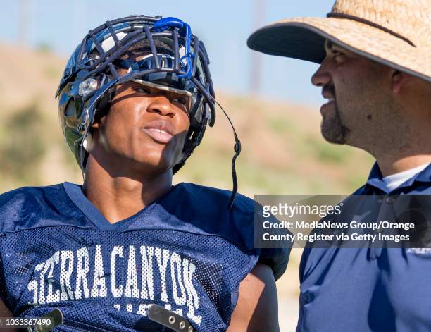 Kaizer Butler, left, running back with Sierra Canyon, speaks with head coach Jon Ellinghouse. ///ADDITIONAL INFORMATION: lar.sierracanyon.0917 √ê...