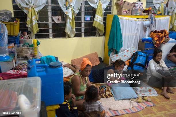 Families gather inside a temporary evacuation center at Balzain East Elementary School ahead of Typhoon Mangkhut's arrival in Tuguegarao, Cagayan...