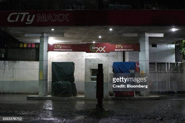 Fuel pumps stand covered in tarpaulin at a gas station ahead of Typhoon Mangkhut's arrival in Tuguegarao, Cagayan province, the Philippines, on...