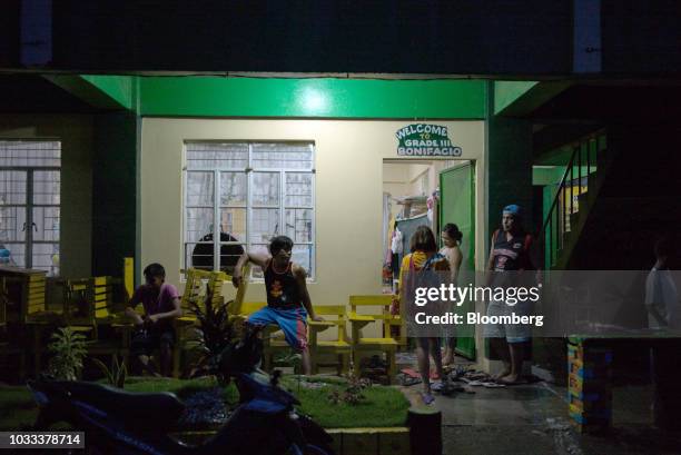 Families gather at a temporary evacuation center at Balzain East Elementary School ahead of Typhoon Mangkhut's arrival in Tuguegarao, Cagayan...