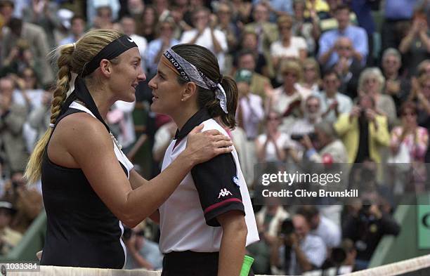 Mary Pierce of France consoles Conchita Martinez of Spain after her straight sets victory over of Spain in the Final of the Womens singles at the...