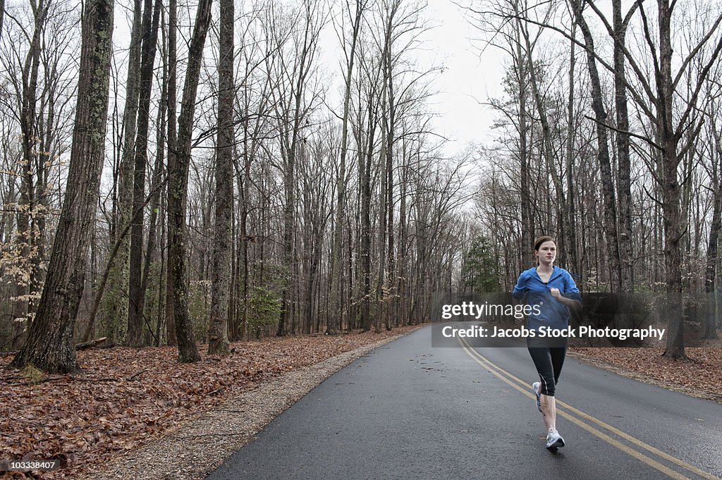 Woman Jogging on Country Road