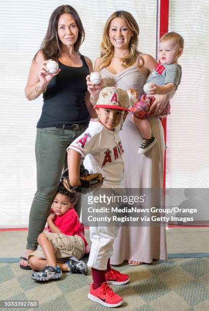 Angel wives, Jody Kendrick, left, and Kristen Weaver with their children, from left, Tyson Kendrick and Owen Kendrick and Aden Weaver, 11-months, are...