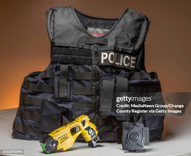 Police tools used in the field include a ballistic vest, taser, and body camera. ///ADDITIONAL INFORMATION: policetools.0923 Ð 9/22/14 Ð LEONARD...