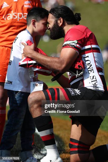 Counties Manukau captain Matiaha Martin gives a jersey to Jonah Lomu's son Brayley ahead of the round five Mitre 10 Cup match between Counties...