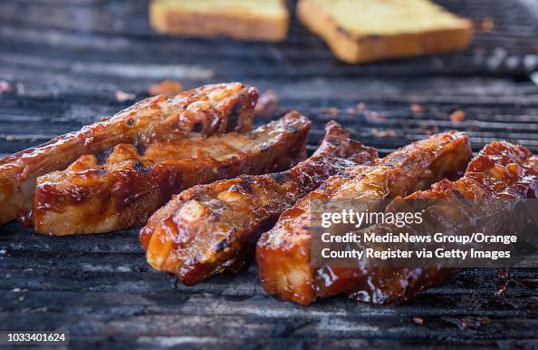 Fire Brigade Rib Ribs cook on the grill at Fireman's Brigade BBQ at Knott's Berry Farm ...