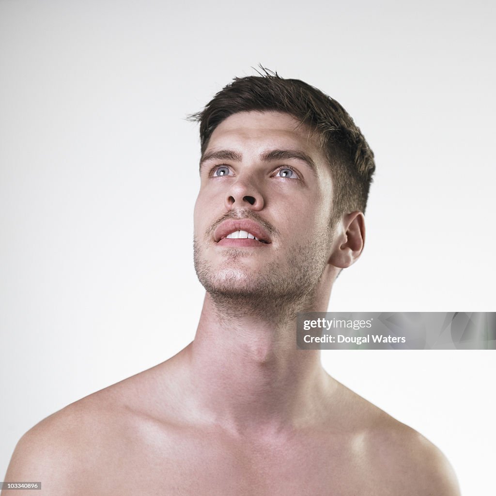 Portrait of man against white background.