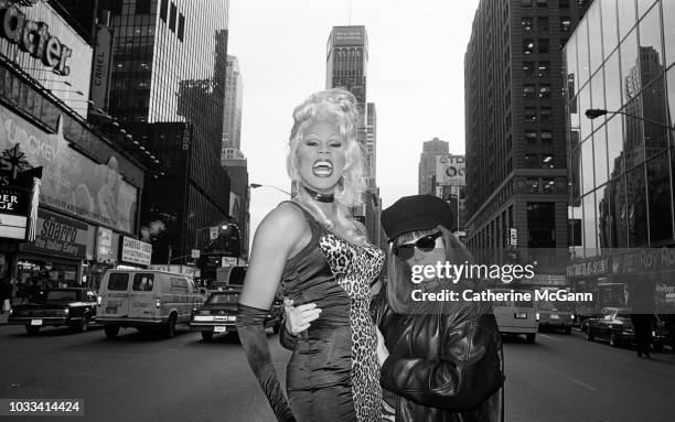 Drag queen RuPaul and Tommy Boy Records executive Monica Lynch pose for a portrait in November 1992 in Times Square in New York City, New York. .