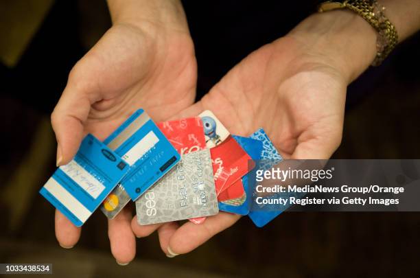 Credit cards are cut in half during a shreading ceremony at Christ Our Redeemer Church in Irvine. ///ADDITIONAL INFORMATION: √ê MINDY SCHAUER, ORANGE...