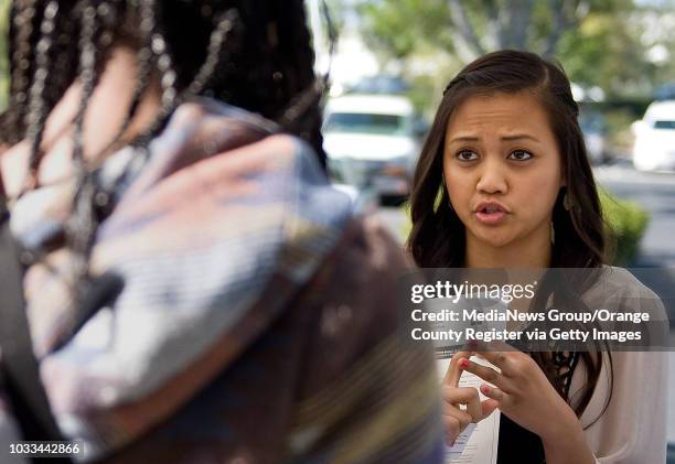 Student and university outreach assistant, Yvonne Cuaresma, talks with Nakiah Daily about colleges at Christ Our Redeemer Church in Irvine....