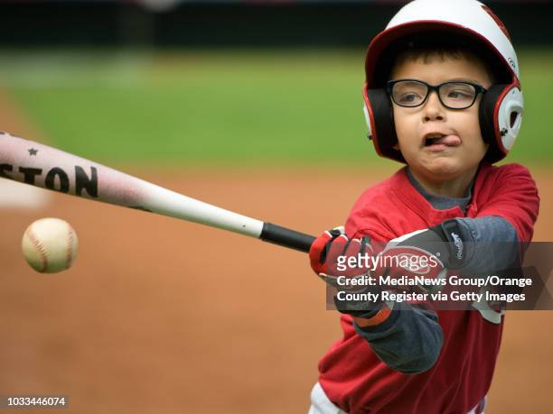 Eight-year-old Eric "Hollywood" Houston, who has a flair for the dramatic according to his mom, keeps a sharp focus on the ball during the Challenger...